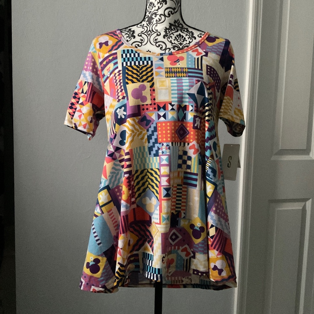 Pastel colorful Disney pattern shirt.